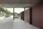 This architectural image showcases a modern structure within a cemetery setting. The design features