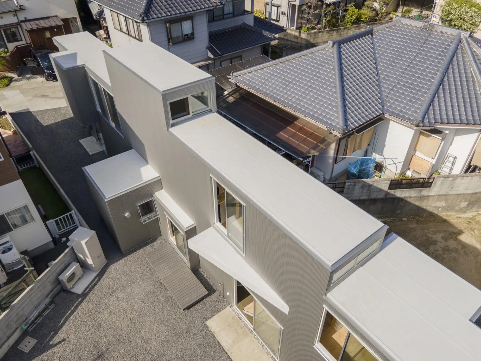 1-1 Architects Turns a Deformed Flagpole Lot into a Layered Countryside Home in Japan