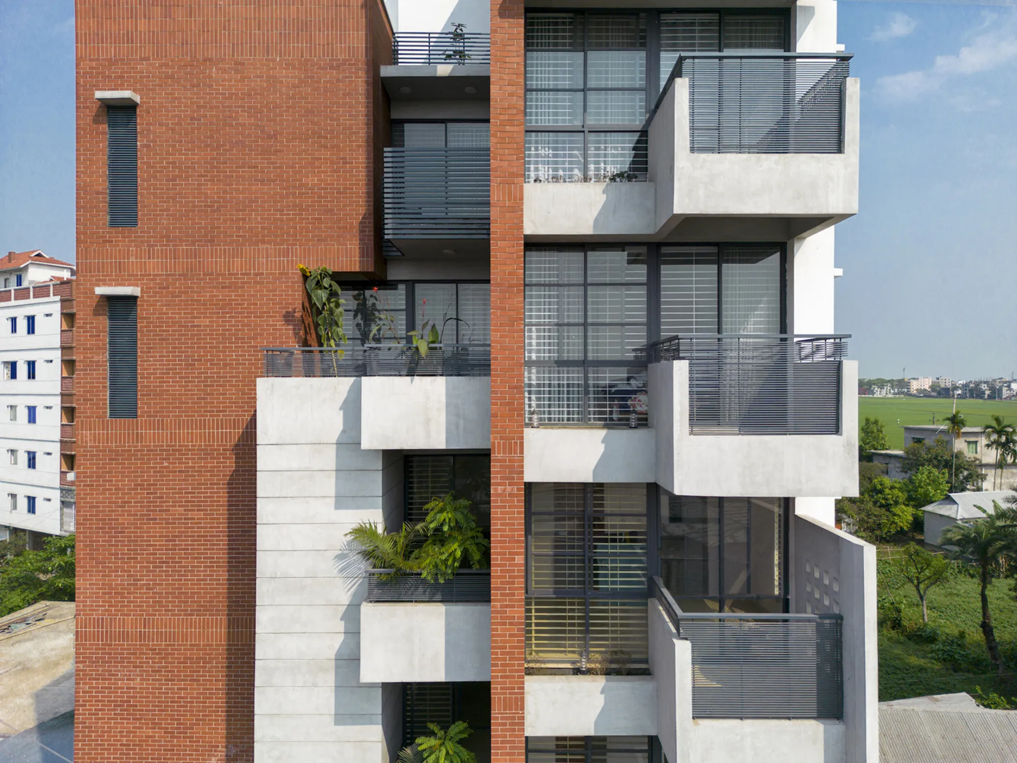 3 Points Consultant Wraps a Netrakona Apartment Tower in Deep Verandahs and Red Brick Armor