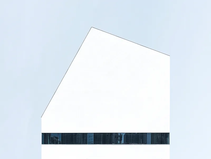 Pentagonal white volume with a horizontal band of glazing reflecting neighboring towers