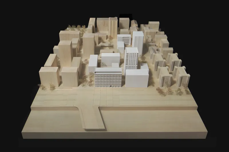 Physical model of mixed-use development showing residential towers and surrounding context buildings