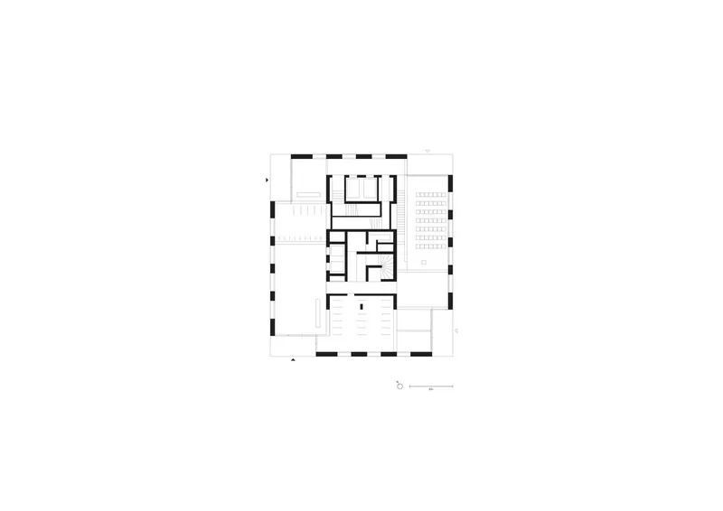 Floor plan drawing showing a perimeter structure with central circulation core and residential units