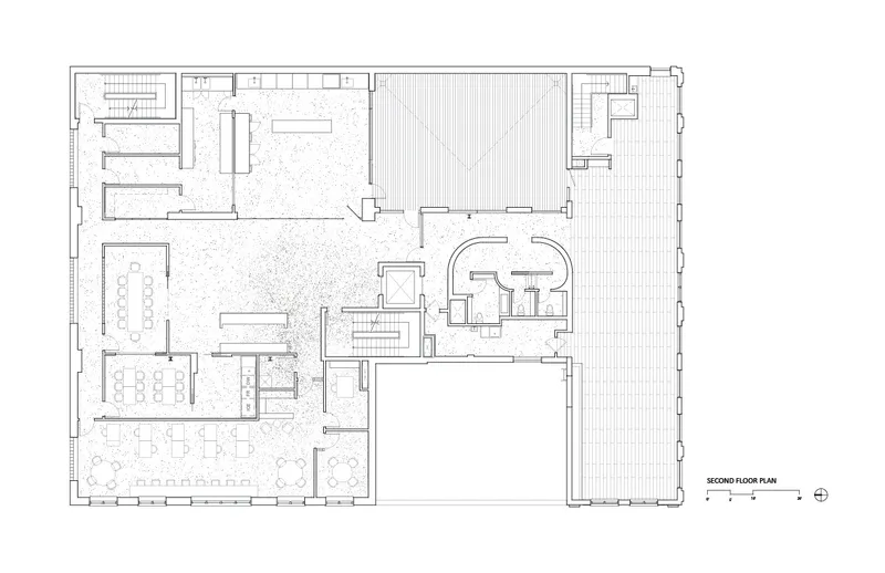 Second-floor plan: food innovation studio, test kitchens, private dining, offices inserted into the warehouse volume