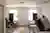 This image depicts the interior of a hospital room, characterized by its minimalist design and clini