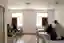 This image depicts the interior of a hospital room, characterized by its minimalist design and clini