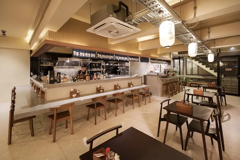 Upper floor JIM's Recipe: warm palette, stone bar, timber stools, paper lanterns, slatted timber ceiling, open kitchen behind