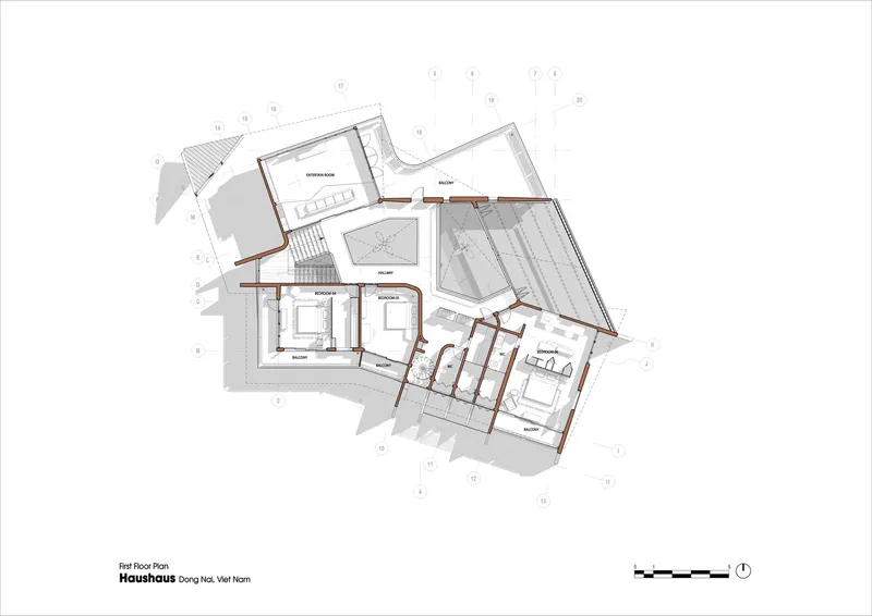First floor plan drawing showing bedrooms and living spaces distributed across the angled wings