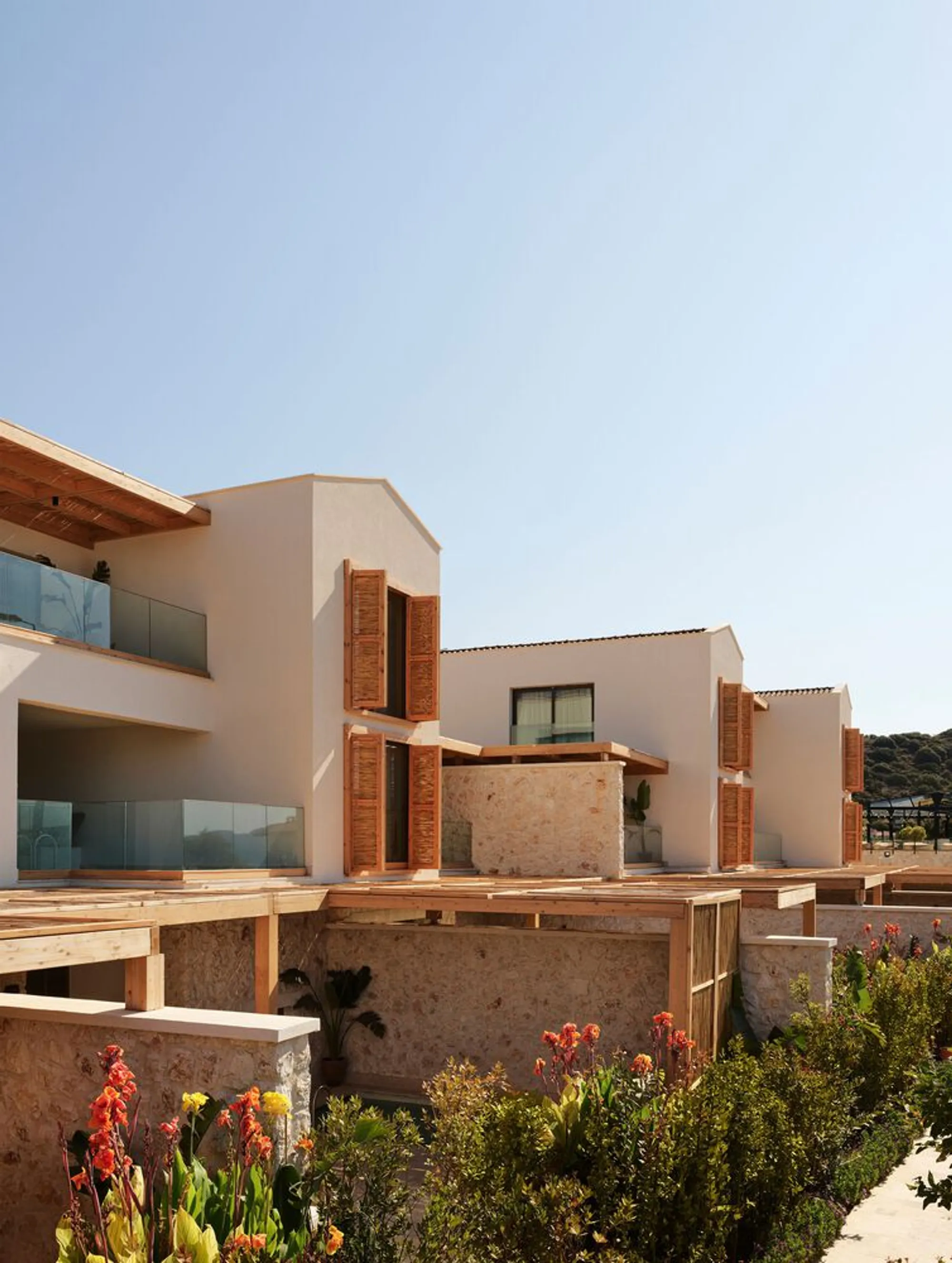 Öznur Çaglayan Scatters a Gabled Village Hotel Along the Kaş Coastline