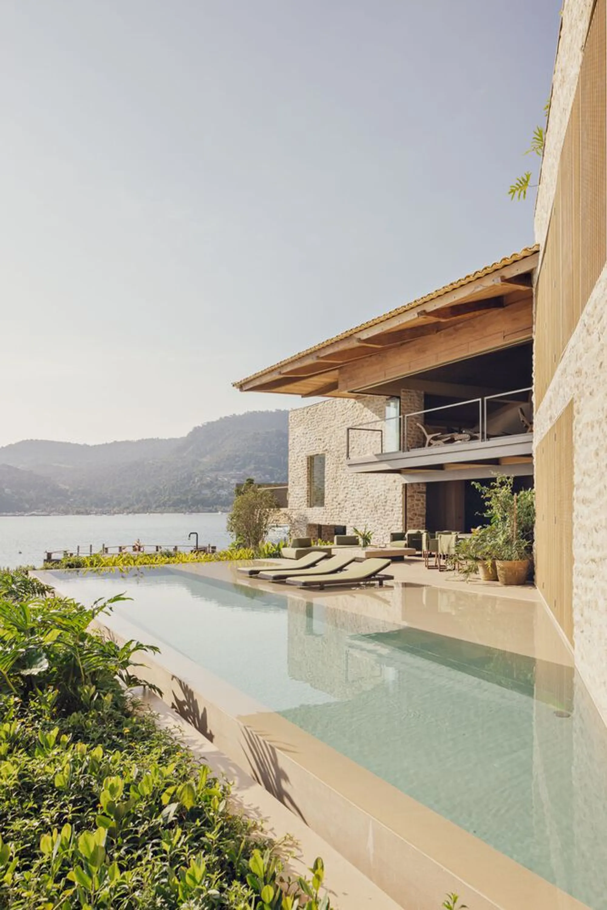Studio Arthur Casas Builds a Stone and Timber Retreat That Dissolves into the Brazilian Coast