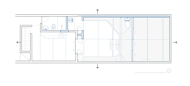 Transverse section through atelier: sliding glass facade, concrete steps, planted courtyard, figures for scale