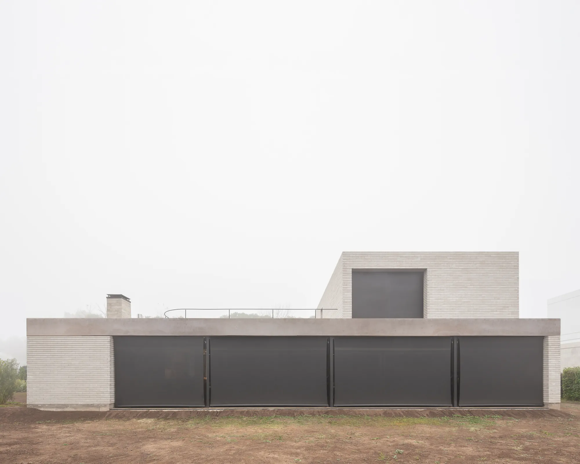 Casa AG: A Brick House on the Edge of the Reserve
