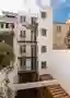 ÔCO Architects Crack Open a Narrow Lisbon Lot to Build a Home Around a Diagonal Courtyard