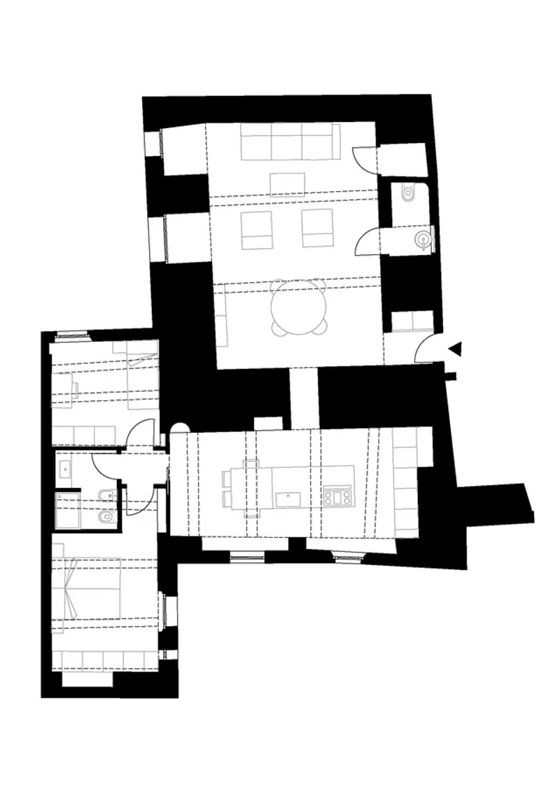 Floor plan drawing showing irregular layout with thick masonry walls and open living spaces