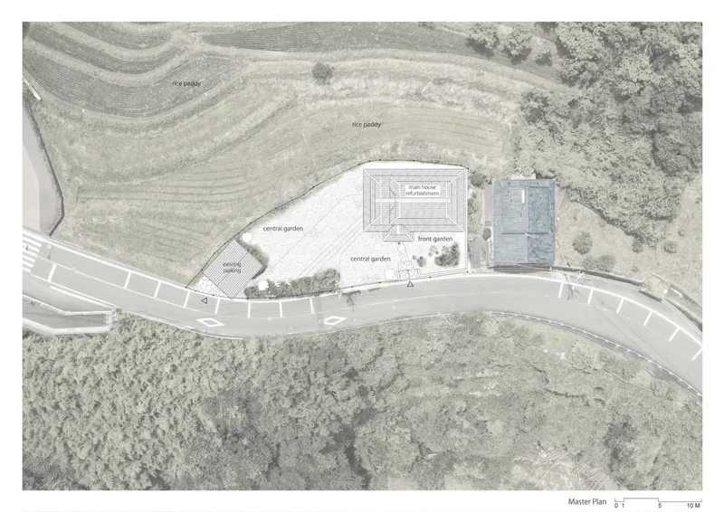 Site plan drawing showing buildings adjacent to a curving road with rice paddies and forest