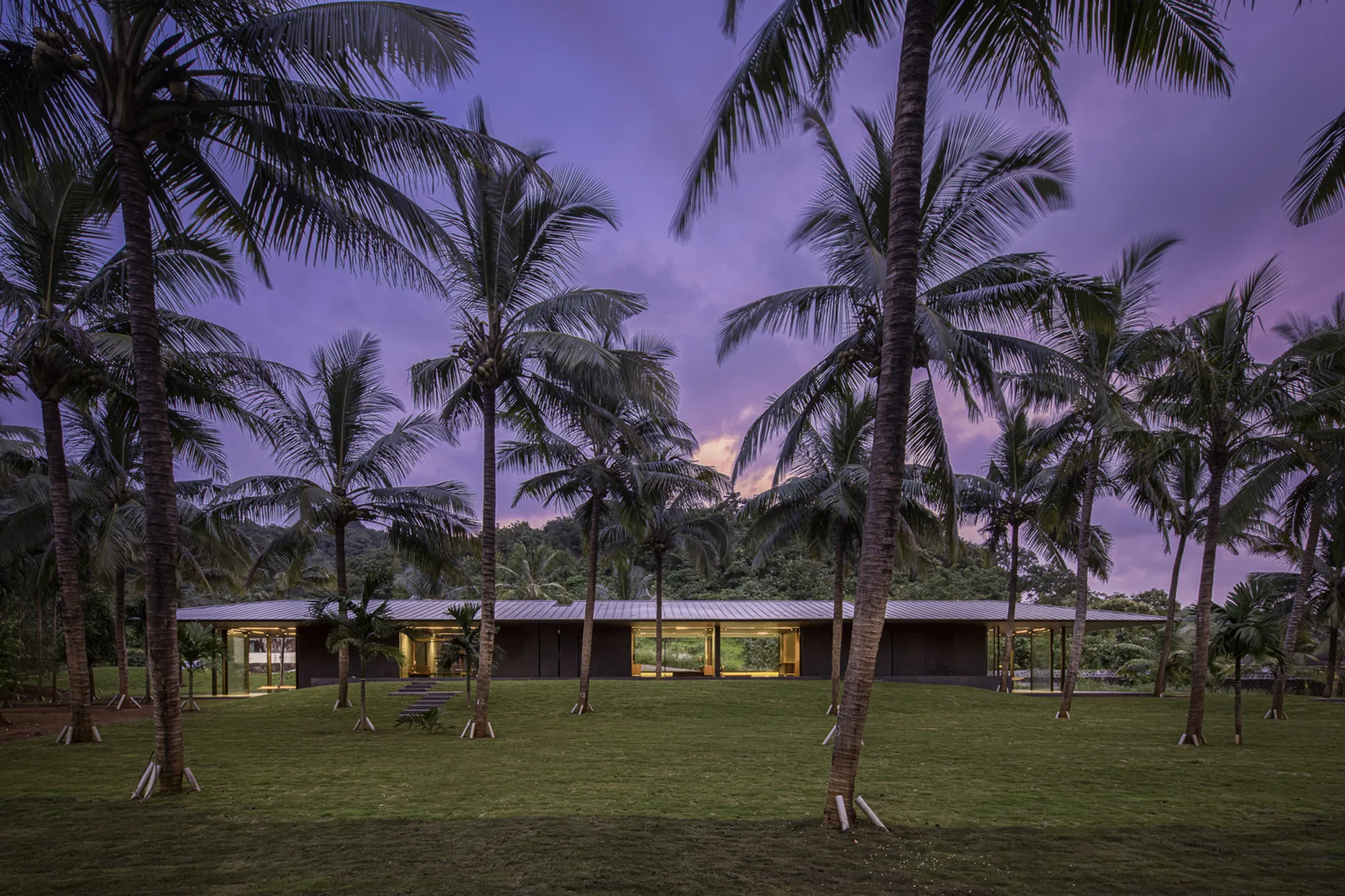 SPASM Design Architects Wrap a Pavilion House Around a Reflecting Pool in Coastal India