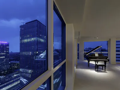 i29 Turns a High-Rise Apartment into a Warm Sequence of Timber-Lined Rooms with a Panoramic View