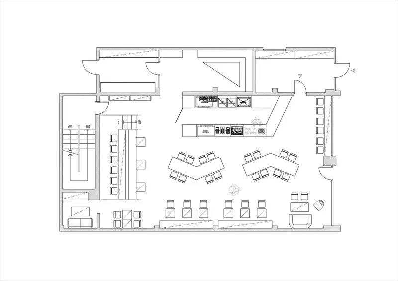 Floor plan: L-shaped layout with raised platform at left, bar counter, seating zones, kitchen, stair, and street entry at bottom