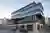 Sergei Tchoban Floats a Dark Glass Office Block Over Berlin's Archaeological Ruins