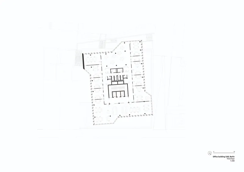 Floor plan drawing showing a central core with radiating office spaces and perimeter columns