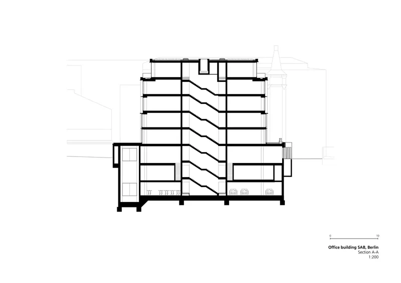 Section drawing showing a central atrium with zigzagging stairs connecting multiple floor levels