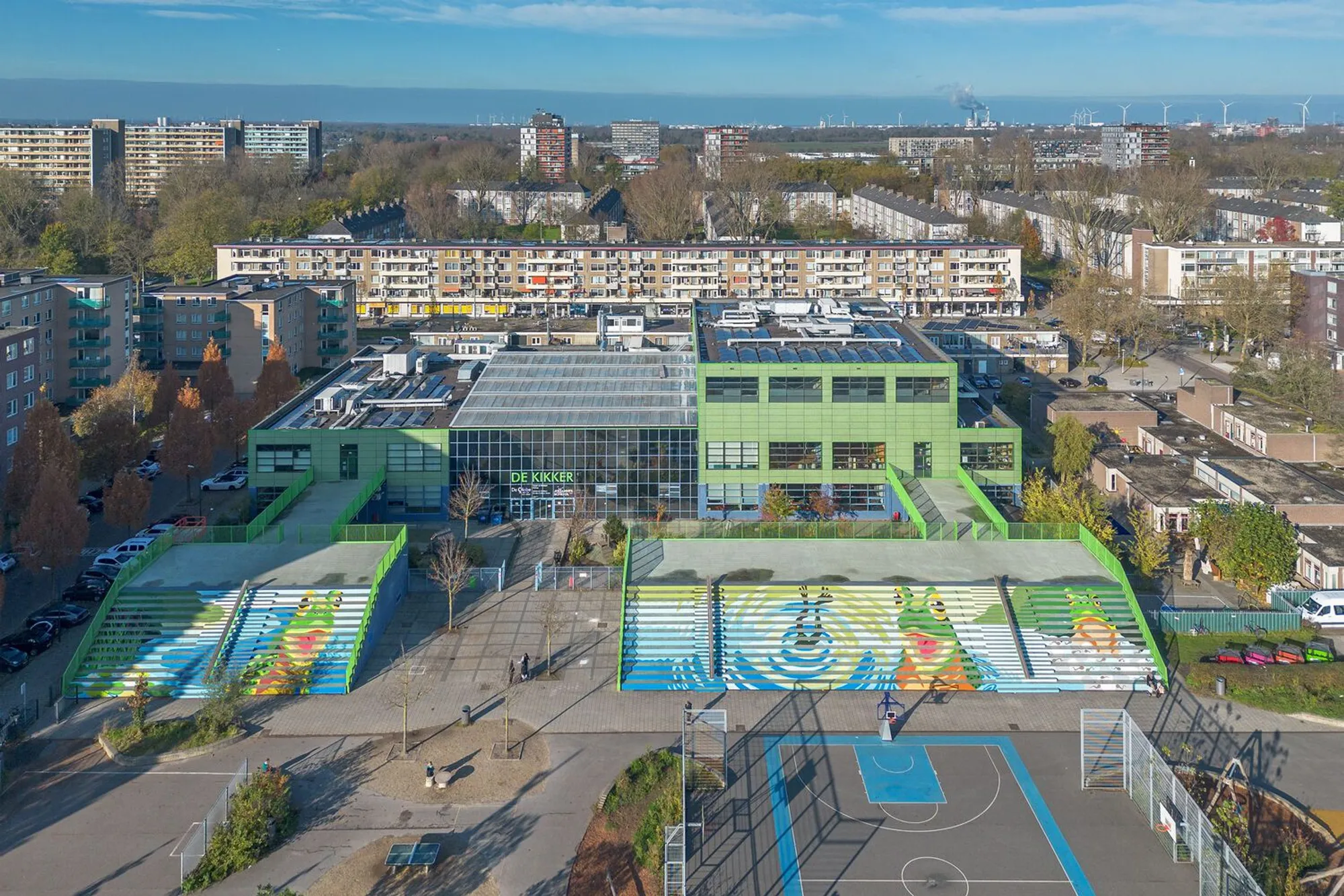 Dok Architecten Wraps an Amsterdam Community School in a Mottled Green Skin