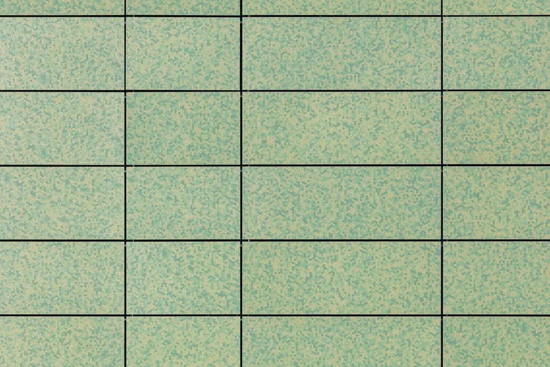 Grid of rectangular panels with mottled green and beige finish showing horizontal joint lines