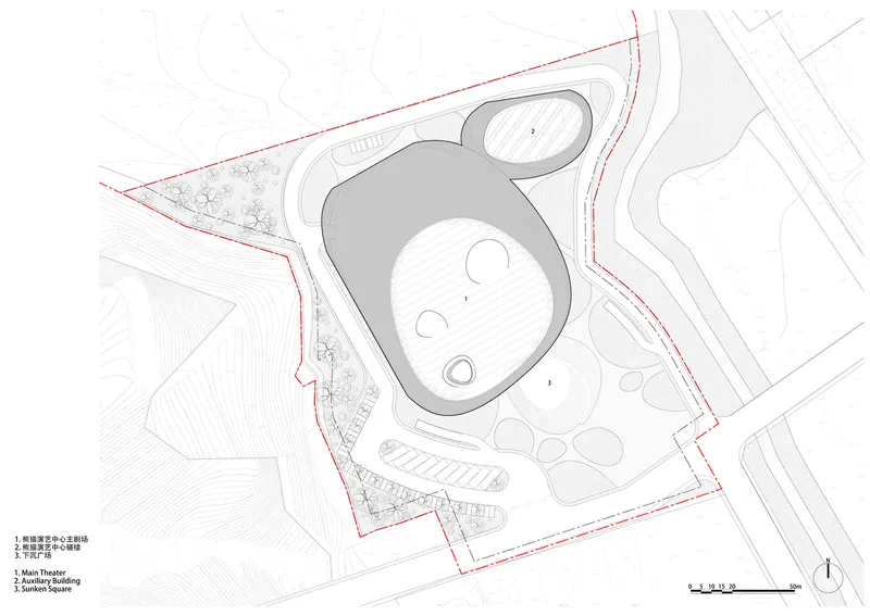 Site plan: two organic volumes within the red site boundary, the larger main theatre and the smaller auxiliary building, landscaped surroundings