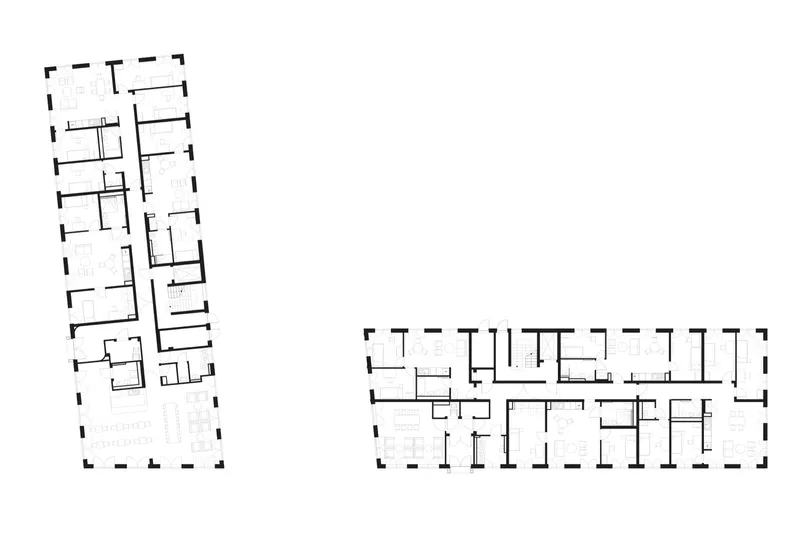 Floor plan drawing showing two rectangular building volumes with central corridors and repeating room modules