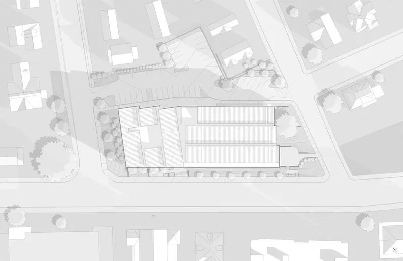 Site plan drawing showing the building footprint within the surrounding urban context with street trees