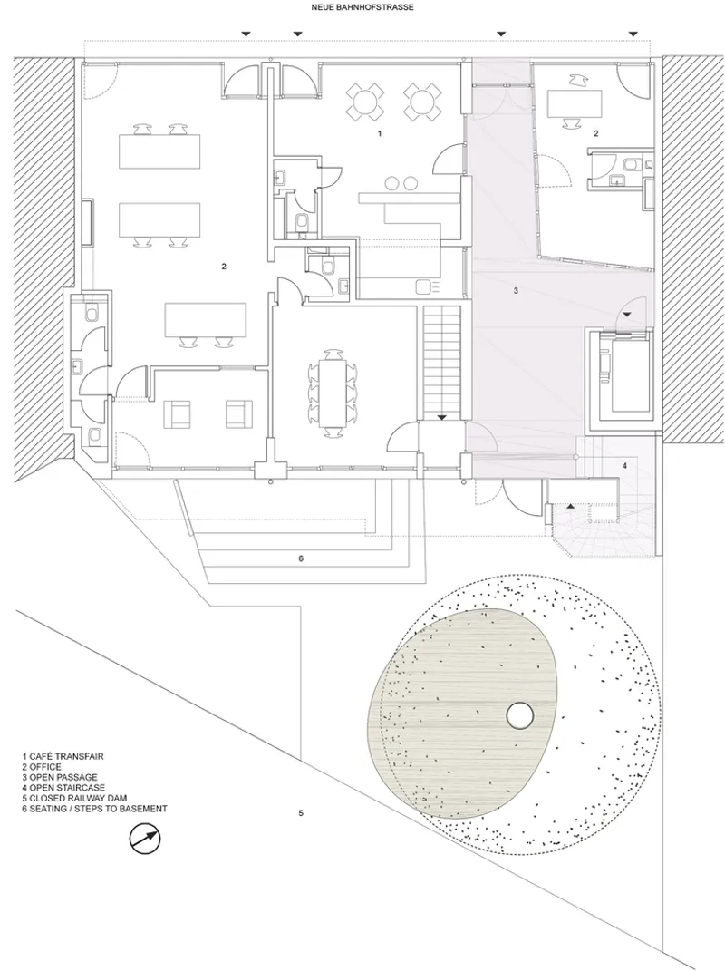 Floor plan drawing showing apartment layout with circular courtyard and timber decking at lower right