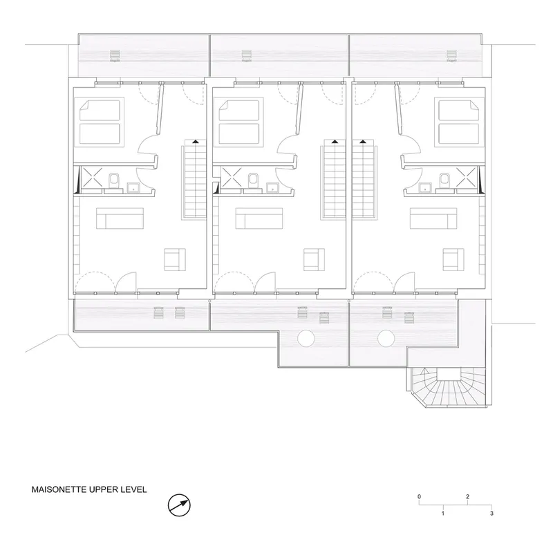 Floor plan drawing of three maisonette units with double-height spaces and staircases