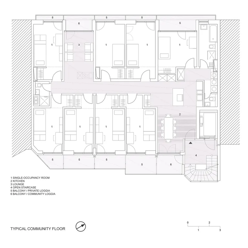 Floor plan drawing of a community floor with single-occupancy rooms surrounding a central lounge