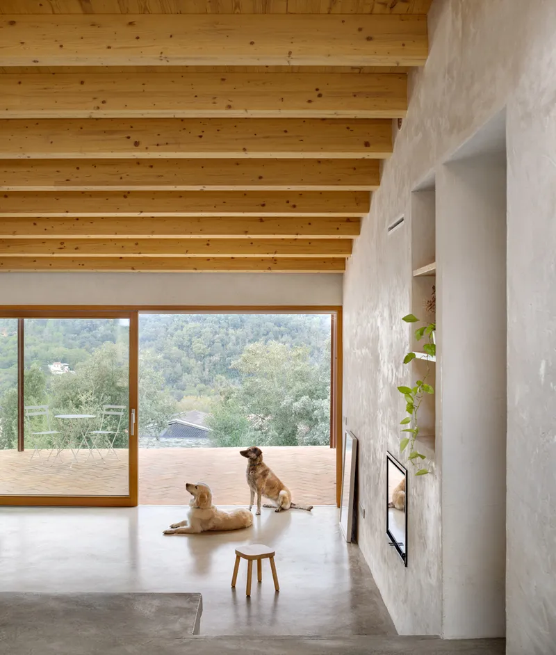 Terrace view: metal bistro furniture, misty mountains, trees, morning light