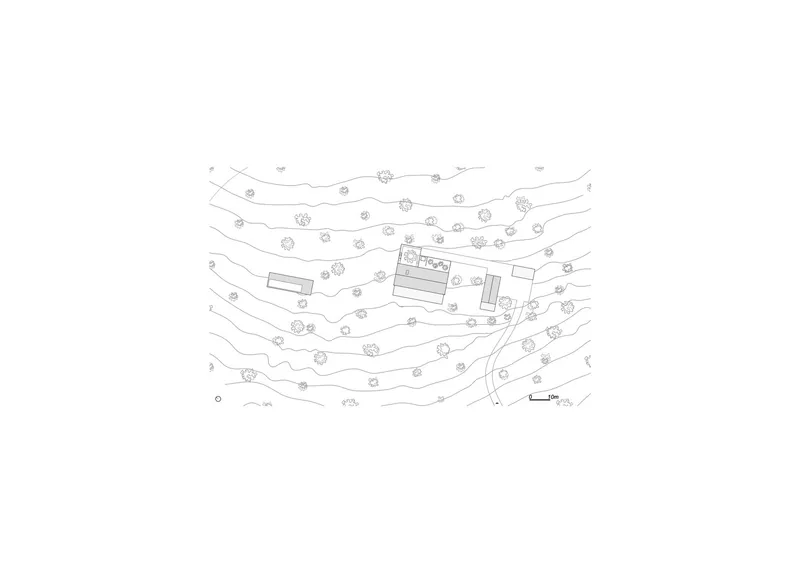 Site plan drawing showing building footprints and scattered tree symbols on contoured terrain
