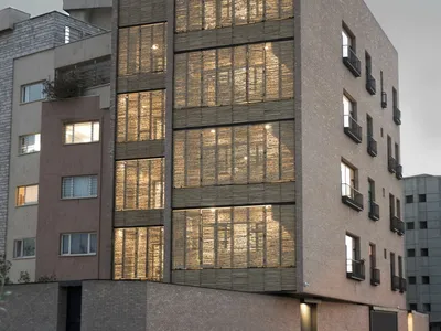 MA Office Wraps an Iranian Residential Tower in Folding Reed Screens and Handmade Brick