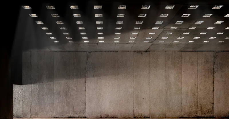 A dramatic play of light through perforated ceilings in the Museum of Memory, symbolizing hope and resilience.