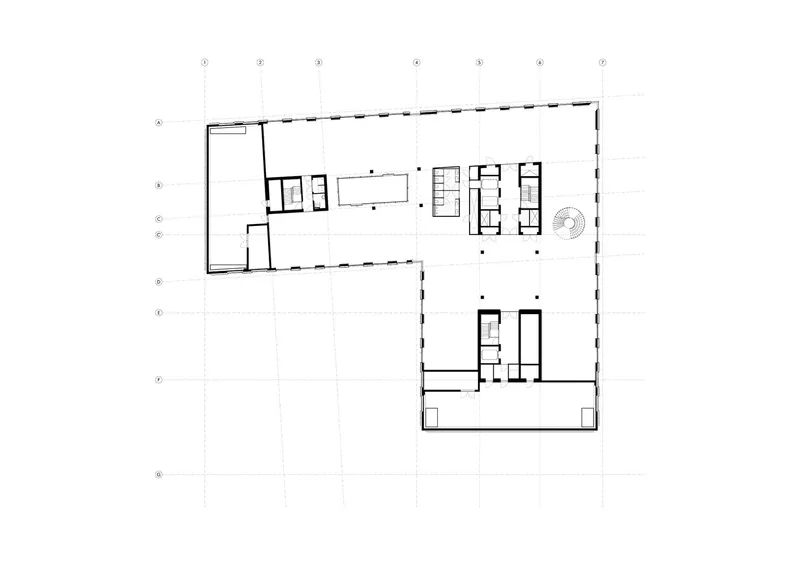 Fourth floor plan showing open workspace with bookshelf clusters and outdoor terrace at corner