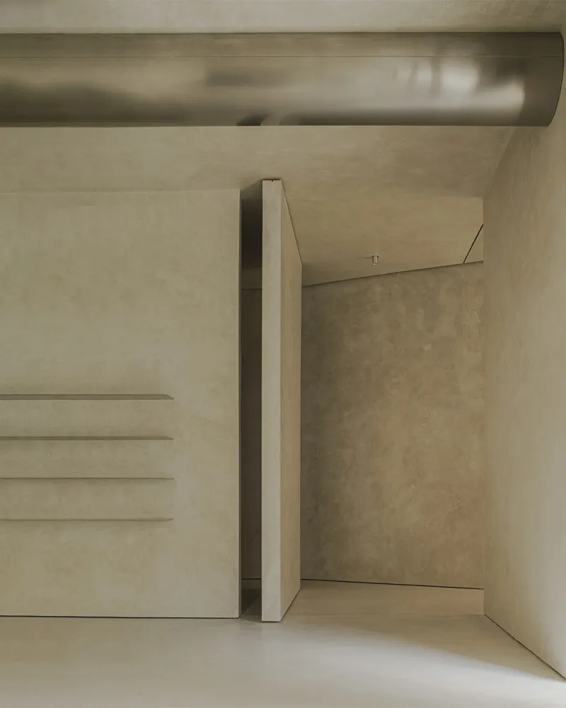 Concrete staircase with integrated floating steps and a slender column beside a narrow passage
