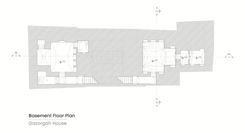 Basement floor plan drawing showing a series of interconnected rooms with two staircases