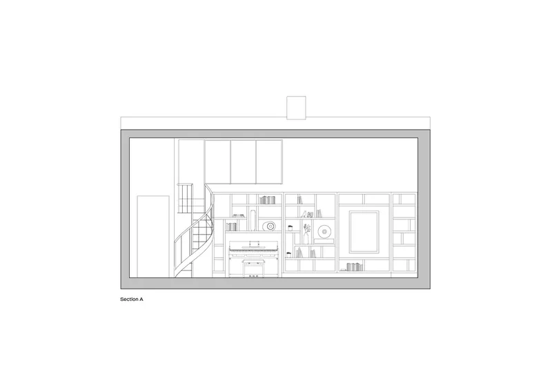 Section drawing showing a two-story interior with staircase, storage wall, and skylight above