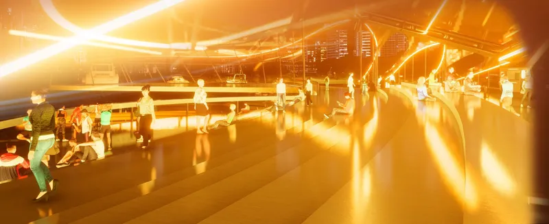 Interior plaza with visitors beneath glowing canopy ribs casting long reflections at sunset