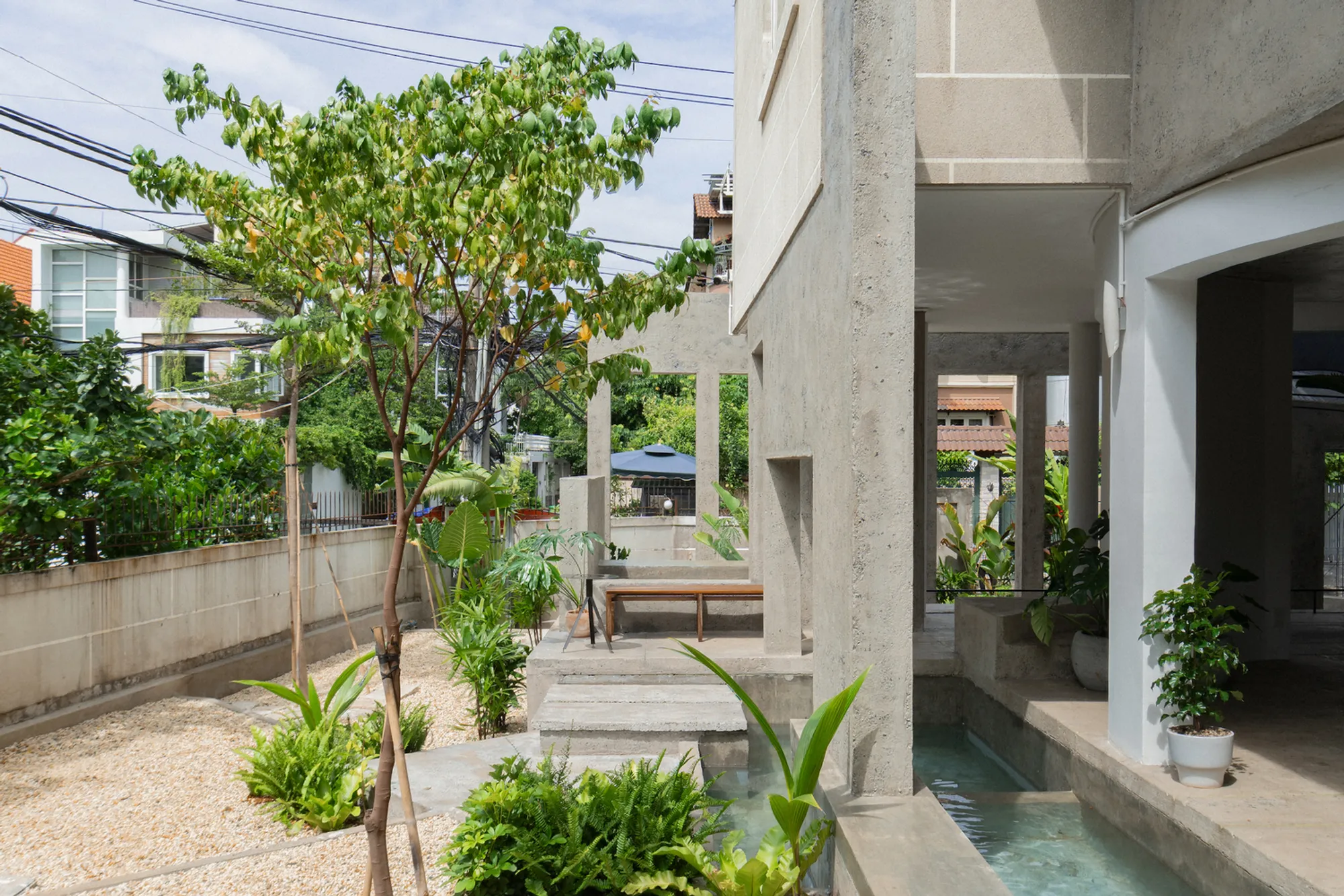 324PRAXIS Turns an Abandoned House in Saigon into a Café Built from Thresholds