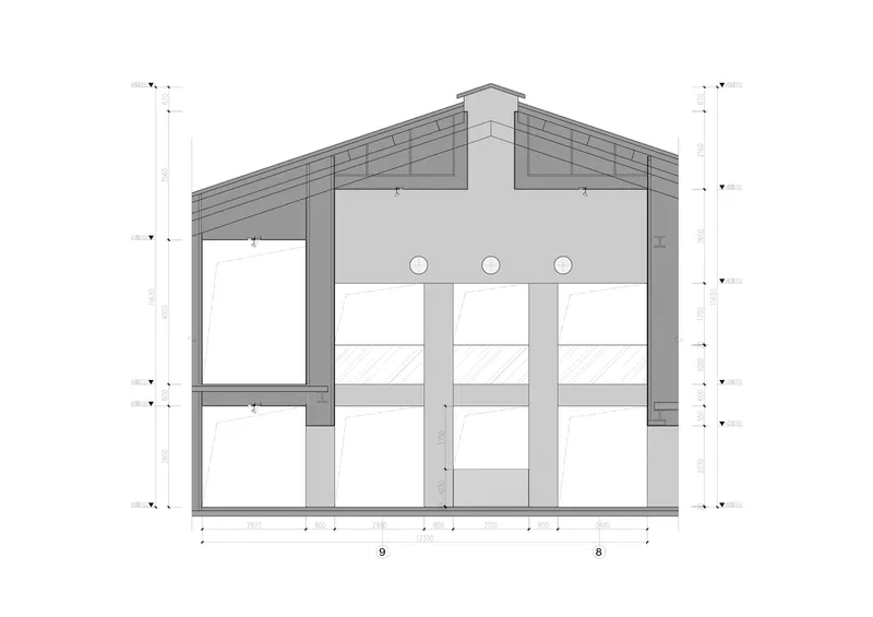 Section through main hall: pitched roof with skylight monitor, three circular openings, double-height column grid, dimensional annotations