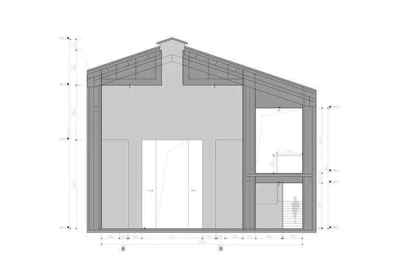 Section through stair wing: pitched roof, stair and upper gallery visible at right, double-height exhibition space at left