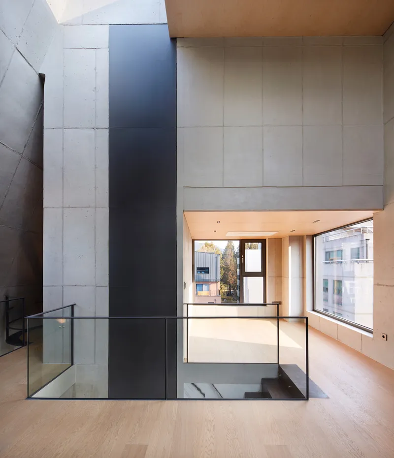 Commercial floor: birch-panelled ceiling, black steel stair, open plan space, louvred window wall