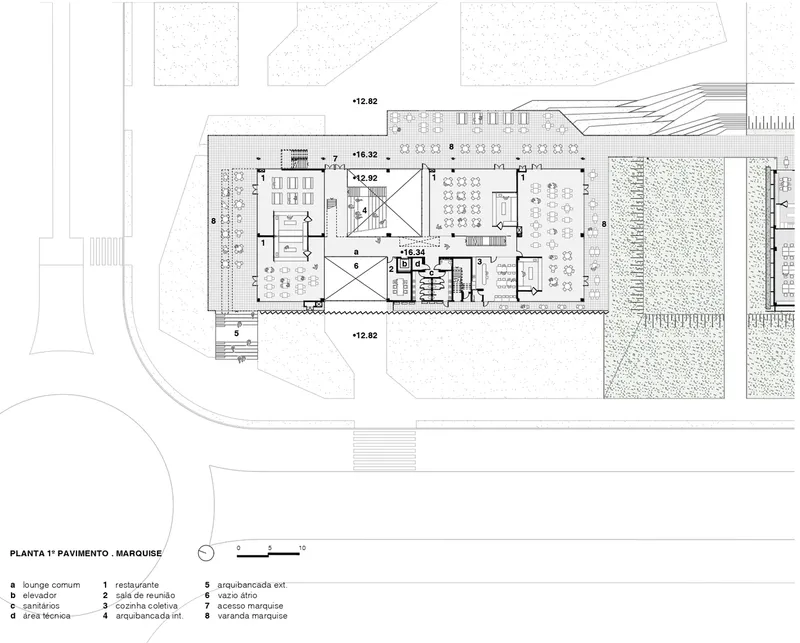 First floor plan drawing showing open workspaces and circulation around a central stair core