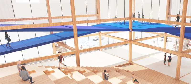 Social core atrium with exposed timber columns, blue fabric canopies suspended as hammock bridges, and a stepped amphitheatre for informal gathering