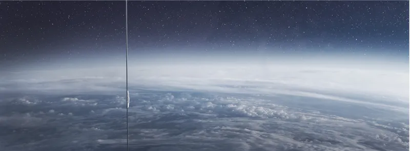 The space elevator tether stretching from Earth's curved horizon upward through the atmosphere into the darkness of space