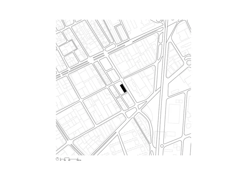 Site plan: building footprint highlighted in black within the surrounding street grid of L'Hospitalet de Llobregat