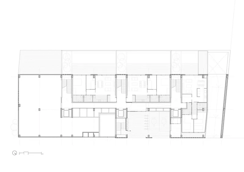 Ground-floor plan: commercial and common spaces at the front, residential units and terraces at the rear, two stair cores